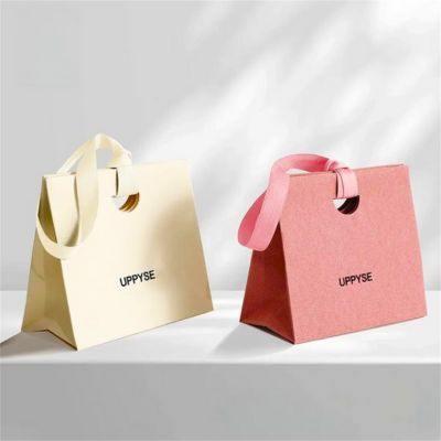 luxury paper bags in special paper and ribbon