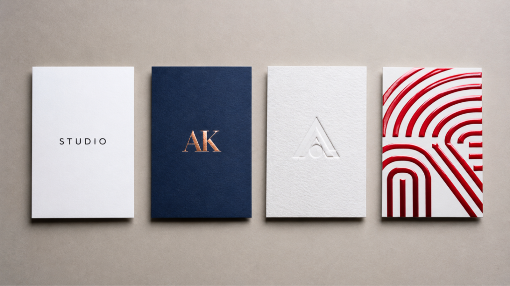 Business cards showing different paper stocks and finishes