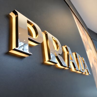 gold plated signage with backlit acrylic base